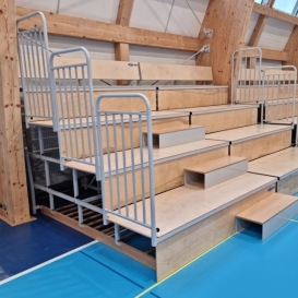 Folding tribunes raised on the wall